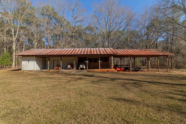 exterior space with an outbuilding, a lawn, and an outdoor structure