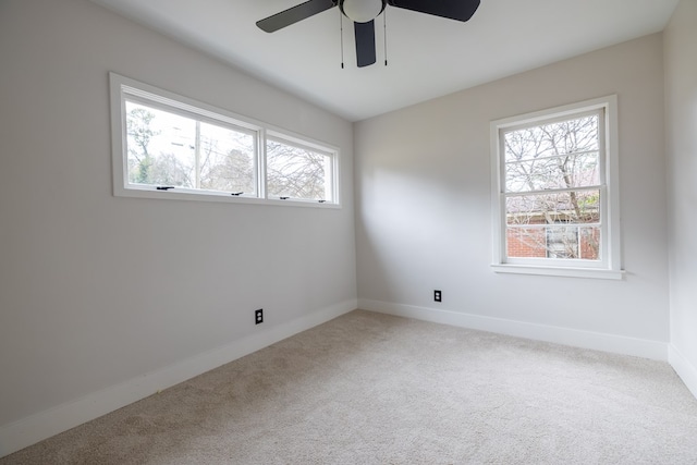 spare room with carpet flooring and baseboards