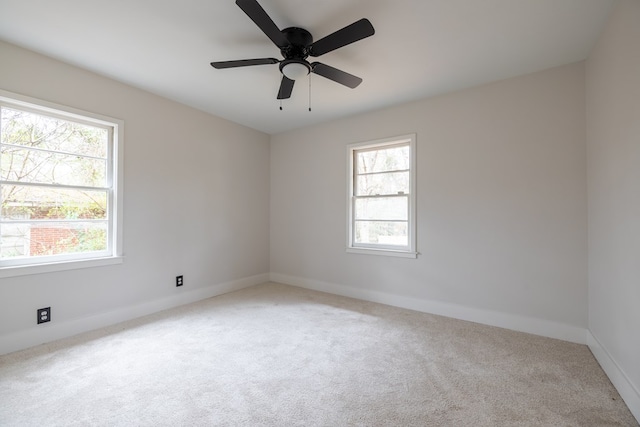 unfurnished room with ceiling fan, carpet flooring, and baseboards