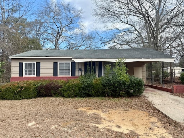 view of front of home featuring a carport