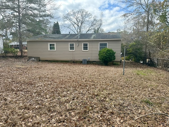 rear view of house with central AC unit