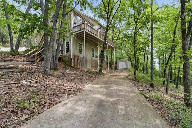 15635 US Highway 0027, Hamilton, GA 31811 - view of front of home with a storage shed, concrete driveway, stairway, a deck, and an outdoor structure