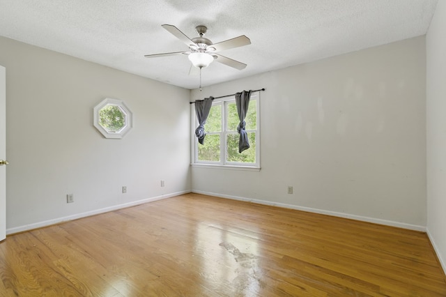 15635 US Highway 0027, Hamilton, GA 31811 - spare room with ceiling fan, baseboards, a textured ceiling, and light wood finished floors
