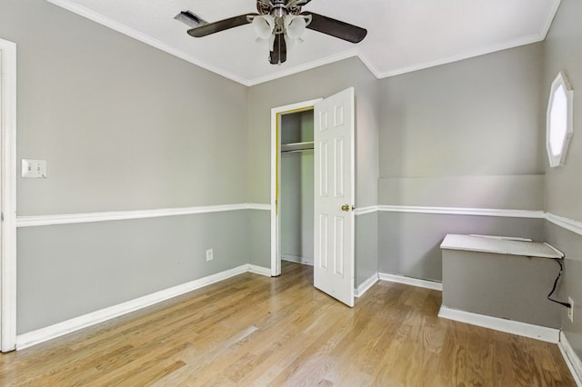 15635 US Highway 0027, Hamilton, GA 31811 - unfurnished bedroom featuring a ceiling fan, crown molding, wood finished floors, a closet, and baseboards