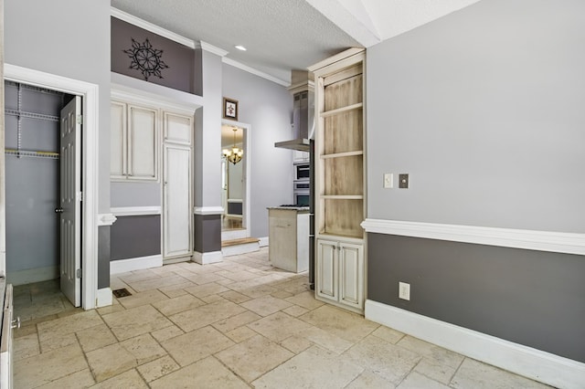 15635 US Highway 0027, Hamilton, GA 31811 - interior space with baseboards, stone tile flooring, a chandelier, and crown molding