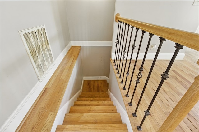 15635 US Highway 0027, Hamilton, GA 31811 - stairs with baseboards, wood finished floors, and visible vents