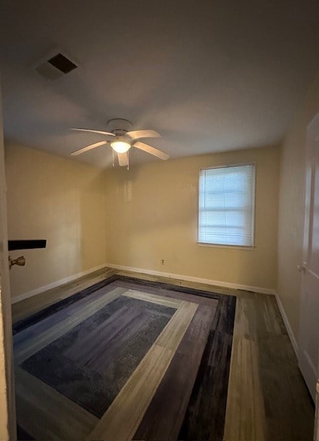 unfurnished room featuring ceiling fan and wood-type flooring