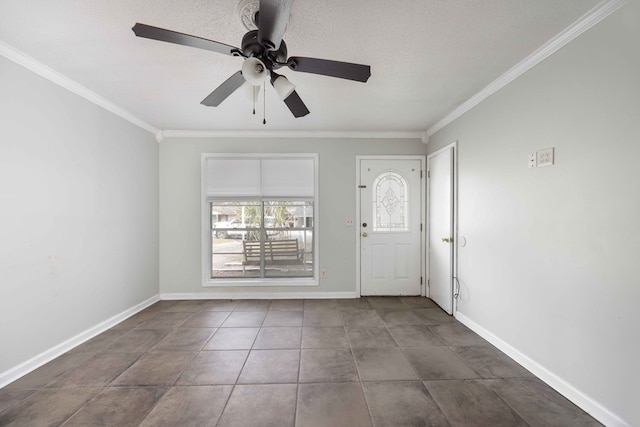 entryway with a textured ceiling, ornamental molding, and baseboards