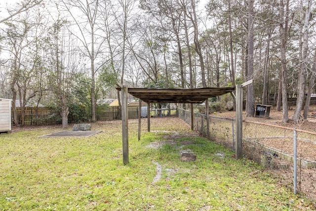 view of yard featuring a fenced backyard and a detached carport