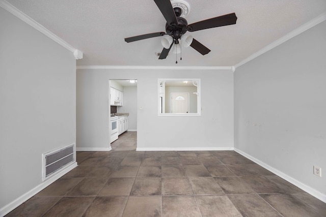 unfurnished room featuring baseboards, visible vents, and ornamental molding