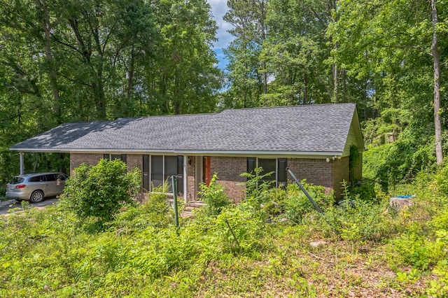 1037 Rockybrook Ct, Columbus, GA 31904 - ranch-style home with brick siding, a shingled roof, and an attached carport