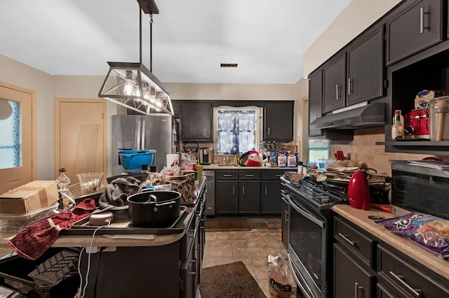 1037 Rockybrook Ct, Columbus, GA 31904 - kitchen featuring under cabinet range hood, appliances with stainless steel finishes, decorative backsplash, light countertops, and healthy amount of natural light