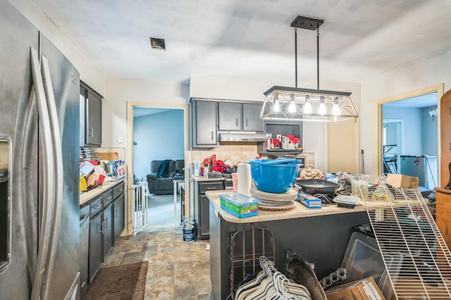 1037 Rockybrook Ct, Columbus, GA 31904 - kitchen with freestanding refrigerator, decorative backsplash, gray cabinetry, stone finish floors, and pendant lighting