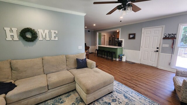 4232 Almond Rd, Fortson, GA 31808 - living area with wood finished floors, ornamental molding, a ceiling fan, wainscoting, and recessed lighting