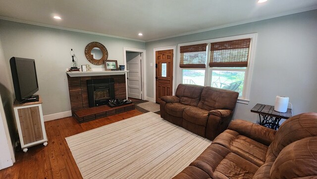 4232 Almond Rd, Fortson, GA 31808 - living room featuring crown molding, baseboards, a brick fireplace, recessed lighting, and dark wood-type flooring