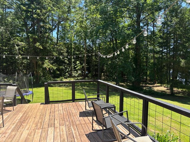 4232 Almond Rd, Fortson, GA 31808 - deck featuring a trampoline and a lawn