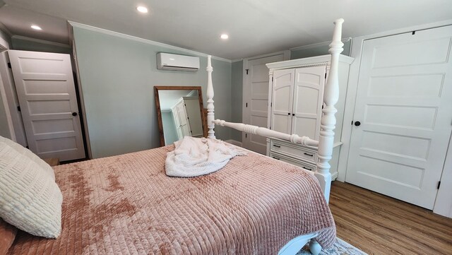 4232 Almond Rd, Fortson, GA 31808 - bedroom featuring a wall unit AC, crown molding, wood finished floors, and recessed lighting
