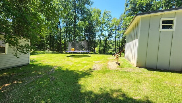 4232 Almond Rd, Fortson, GA 31808 - view of grassy yard with a trampoline