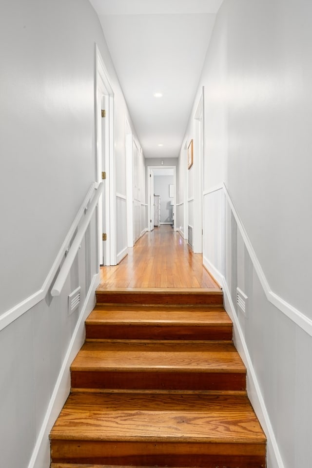 stairs with wood finished floors