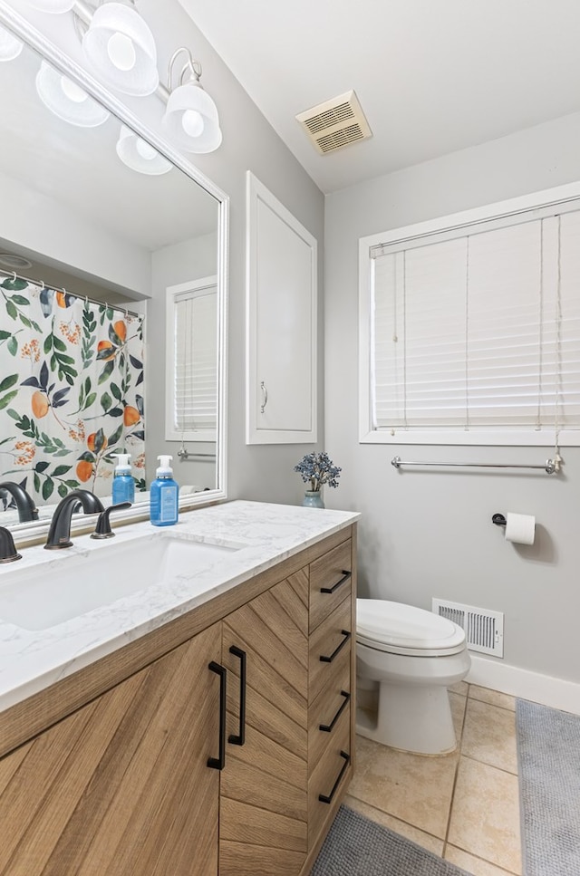 full bathroom with toilet, tile patterned flooring, vanity, and visible vents