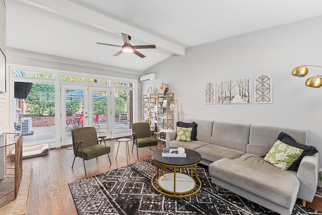 living area featuring vaulted ceiling with beams, wood finished floors, a ceiling fan, french doors, and a wall mounted AC