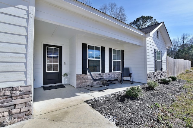 entrance to property featuring covered porch