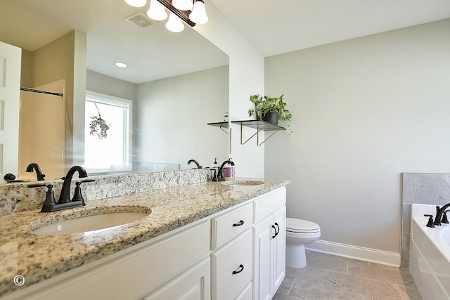 bathroom with toilet, a tub to relax in, and vanity