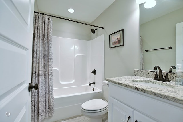 full bathroom featuring toilet, vanity, and shower / bathtub combination with curtain