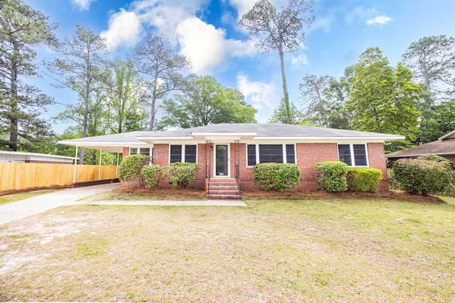 ranch-style home with fence, a front lawn, driveway, and brick siding