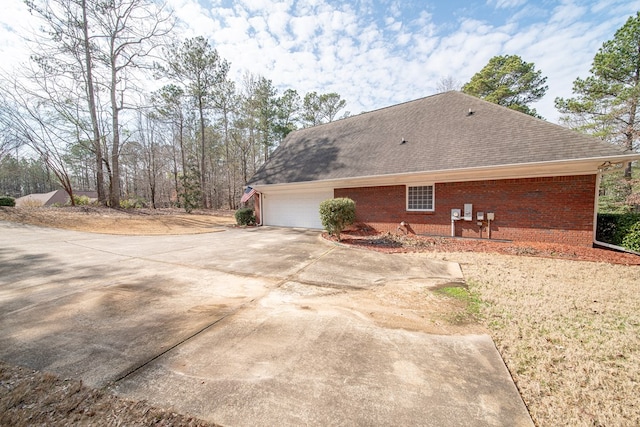 view of side of property with a garage