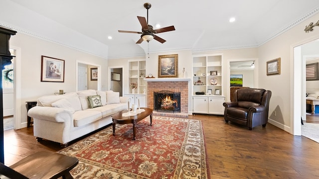 6359 Cape Cod Dr, Columbus, GA 31904 - living area featuring a ceiling fan, wood finished floors, a fireplace, built in shelves, and recessed lighting