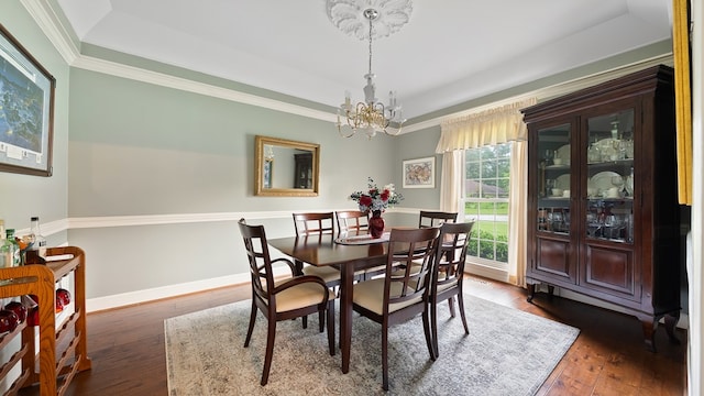 6359 Cape Cod Dr, Columbus, GA 31904 - dining room with a raised ceiling, a chandelier, hardwood / wood-style floors, and ornamental molding