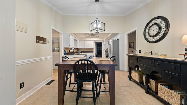 6359 Cape Cod Dr, Columbus, GA 31904 - dining room with ornamental molding, light tile patterned floors, and a chandelier