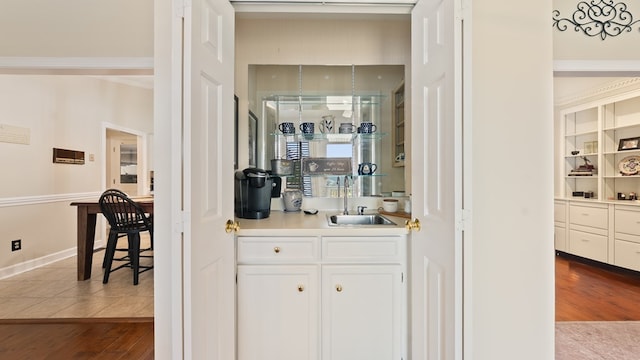 6359 Cape Cod Dr, Columbus, GA 31904 - bar featuring dark wood finished floors and crown molding