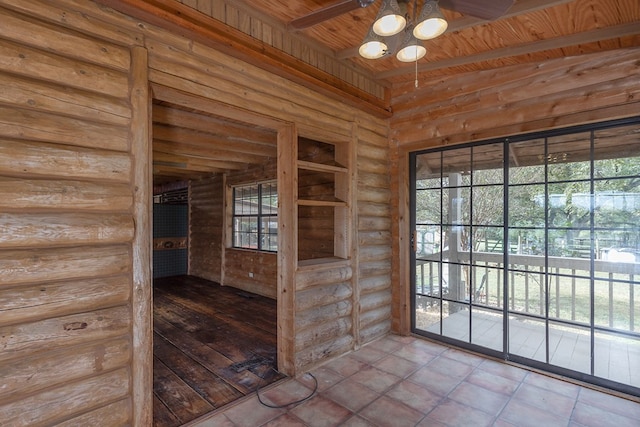 doorway with rustic walls, wooden ceiling, and a healthy amount of sunlight