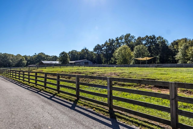 view of gate featuring a rural view