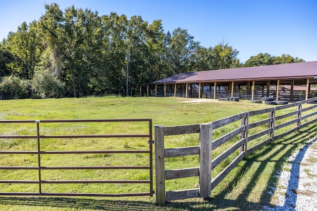 view of stable with a rural view