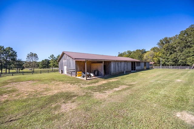 exterior space with a rural view and an outdoor structure