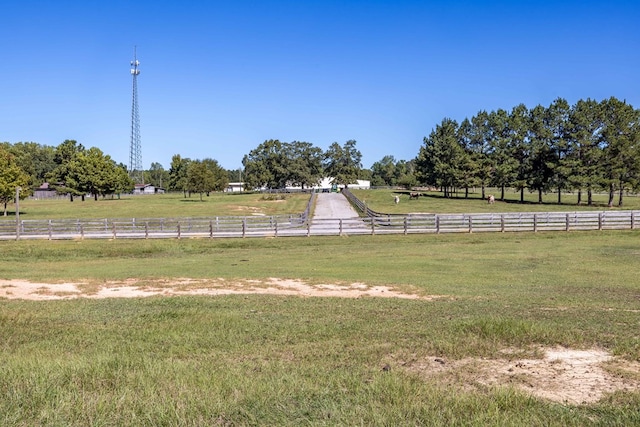 view of yard with a rural view