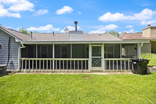 4608 Mayo Dr, Columbus, GA 31909 - back of house featuring a sunroom, roof with shingles, a chimney, and a lawn