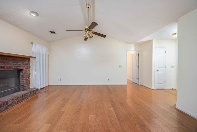 4608 Mayo Dr, Columbus, GA 31909 - unfurnished living room featuring ceiling fan, vaulted ceiling, light wood-style floors, and a fireplace