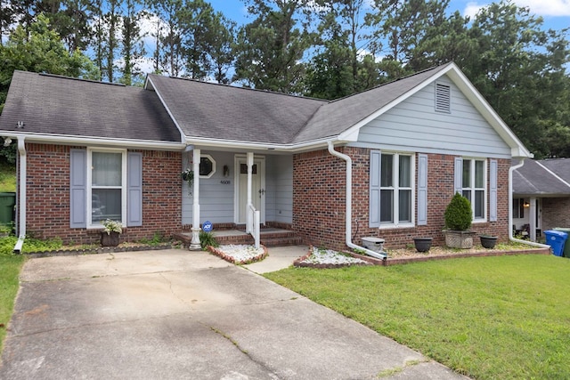4608 Mayo Dr, Columbus, GA 31909 - ranch-style home featuring brick siding, a front yard, covered porch, and a shingled roof