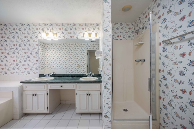 4608 Mayo Dr, Columbus, GA 31909 - full bathroom with wallpapered walls, double vanity, a stall shower, tile patterned floors, and a bath