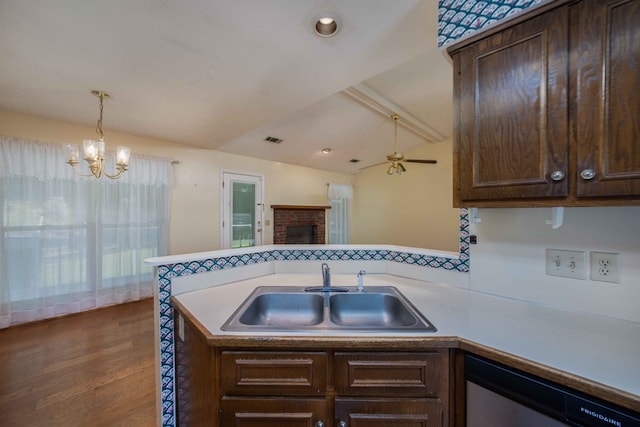 4608 Mayo Dr, Columbus, GA 31909 - kitchen with stainless steel dishwasher, dark brown cabinetry, and a chandelier