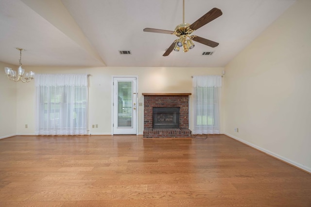 4608 Mayo Dr, Columbus, GA 31909 - unfurnished living room featuring a chandelier, wood finished floors, ceiling fan, lofted ceiling, and a fireplace