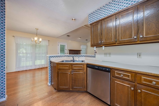 4608 Mayo Dr, Columbus, GA 31909 - kitchen featuring stainless steel dishwasher, a chandelier, light wood-type flooring, light countertops, and vaulted ceiling