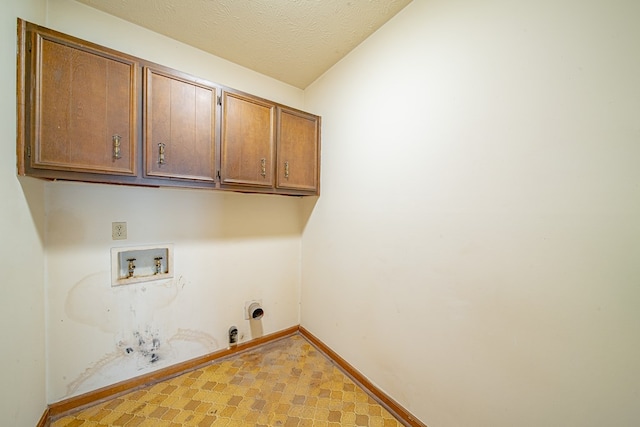 laundry area with cabinet space, gas dryer hookup, tile patterned floors, hookup for a washing machine, and hookup for an electric dryer