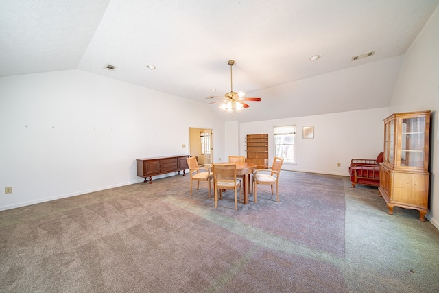 dining area featuring carpet floors, visible vents, vaulted ceiling, and a ceiling fan