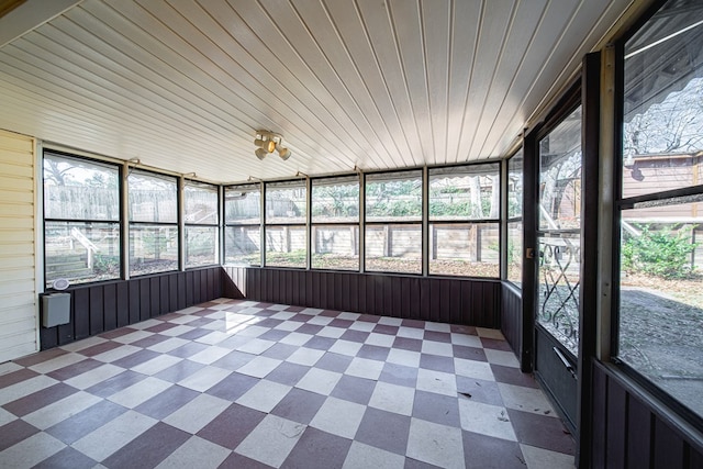 unfurnished sunroom featuring wood ceiling