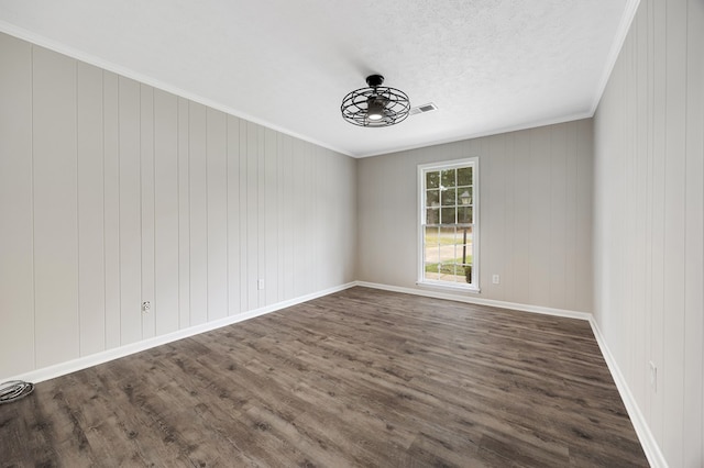 2245 Gennings Ct, Columbus, GA 31907 - empty room with dark wood finished floors and ornamental molding